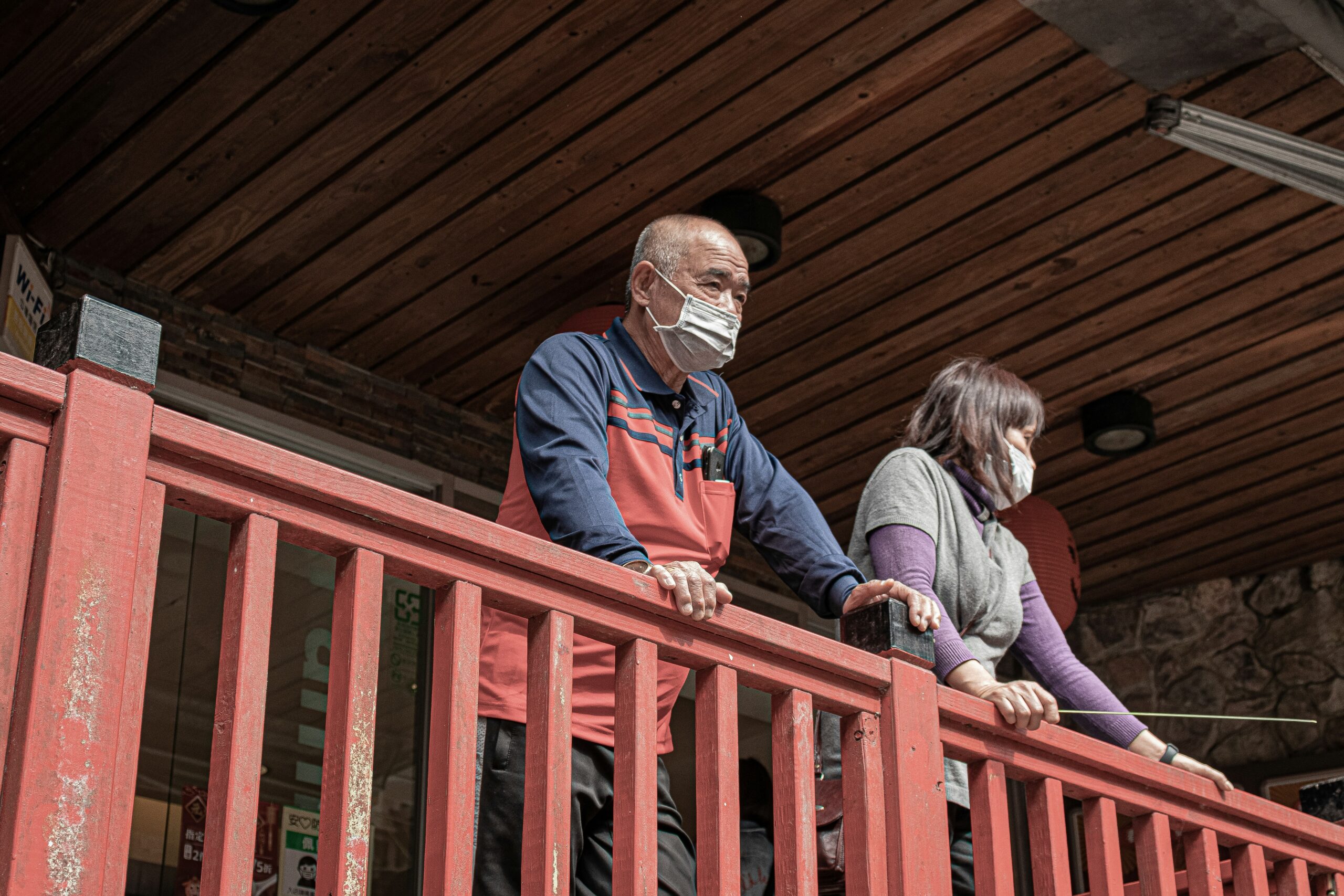 A smiling family standing outside their newly cleaned home after successful mold remediation