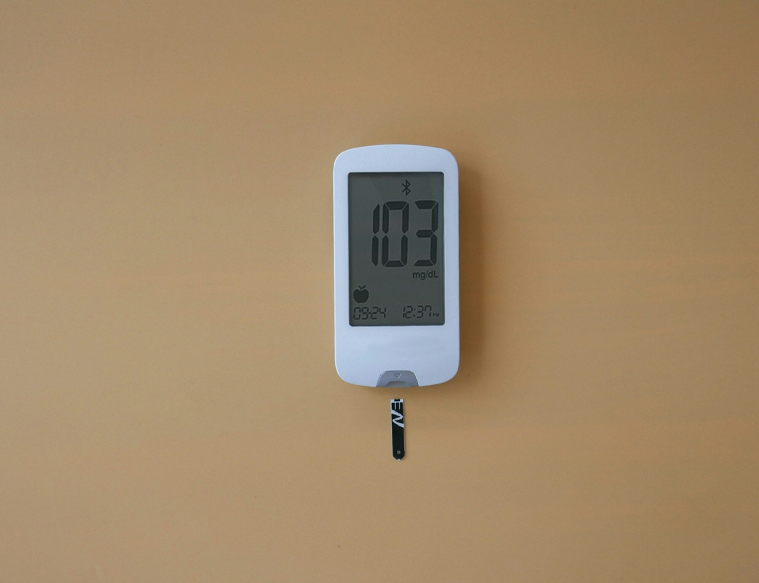 A portable dehumidifier plugged in near a window setup